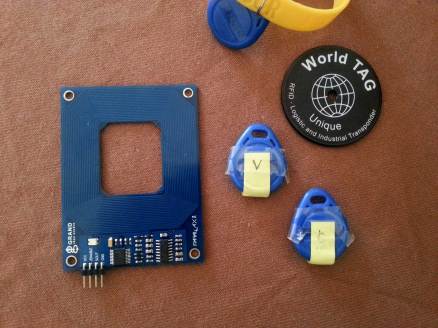 Parallax reader and awkward shaped tags. You have to present the V and C tags in the right order to unlock the door! Fun!